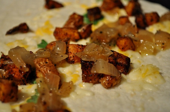 Potatoes, onions and cheese on the tortilla
